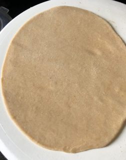 Roll out the oval shape roti