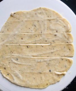 Apply maida-oil paste on top of pakwan